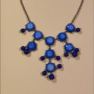 Used blue costume necklace with gold accent